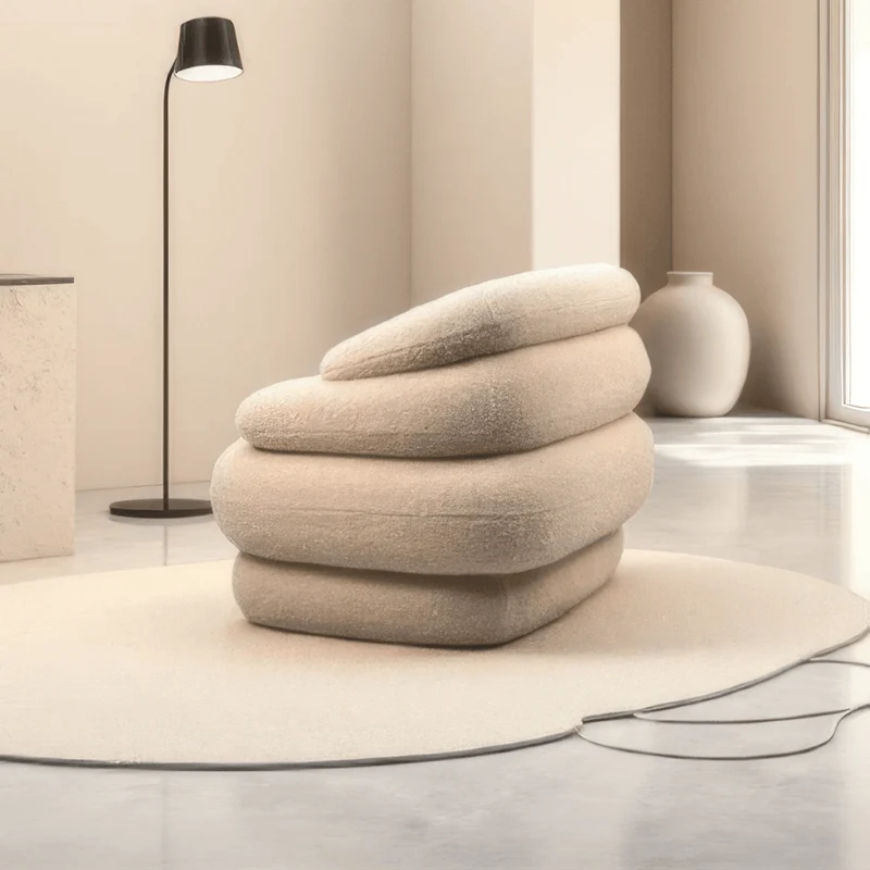 Soar Sculptural Swivel Sofa in Faux Shearling